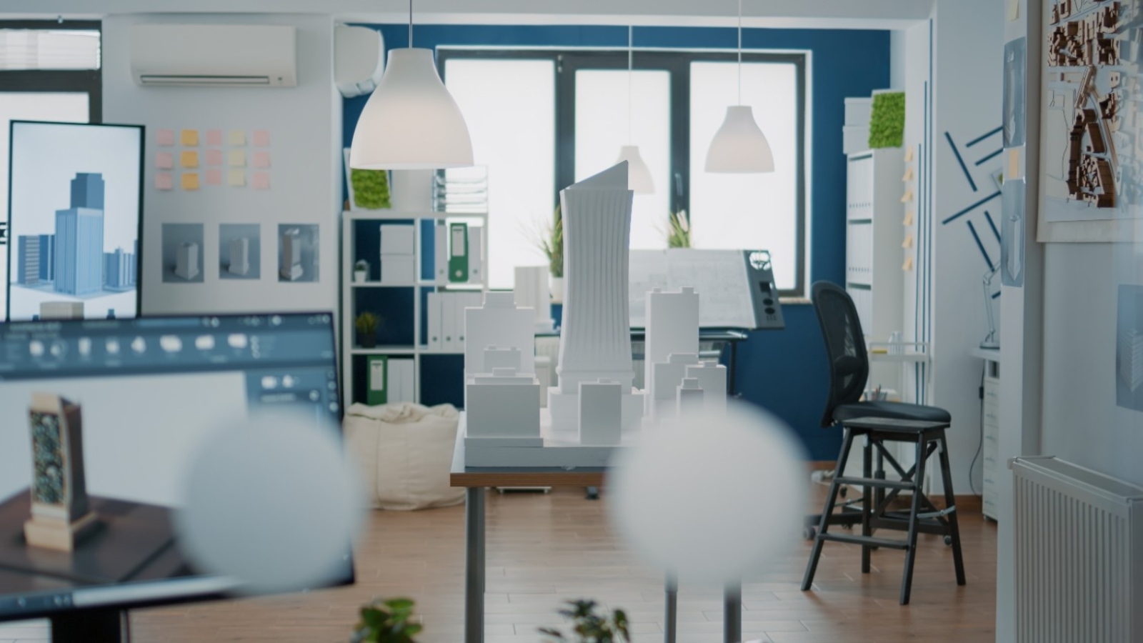 empty-architectural-office-with-building-model-blueprints-plans-table-nobody-space-used-real-estate-design-development-with-architecture-construction-structure (1)