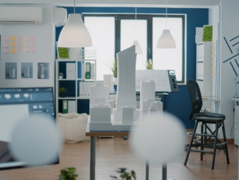 empty-architectural-office-with-building-model-blueprints-plans-table-nobody-space-used-real-estate-design-development-with-architecture-construction-structure (1)