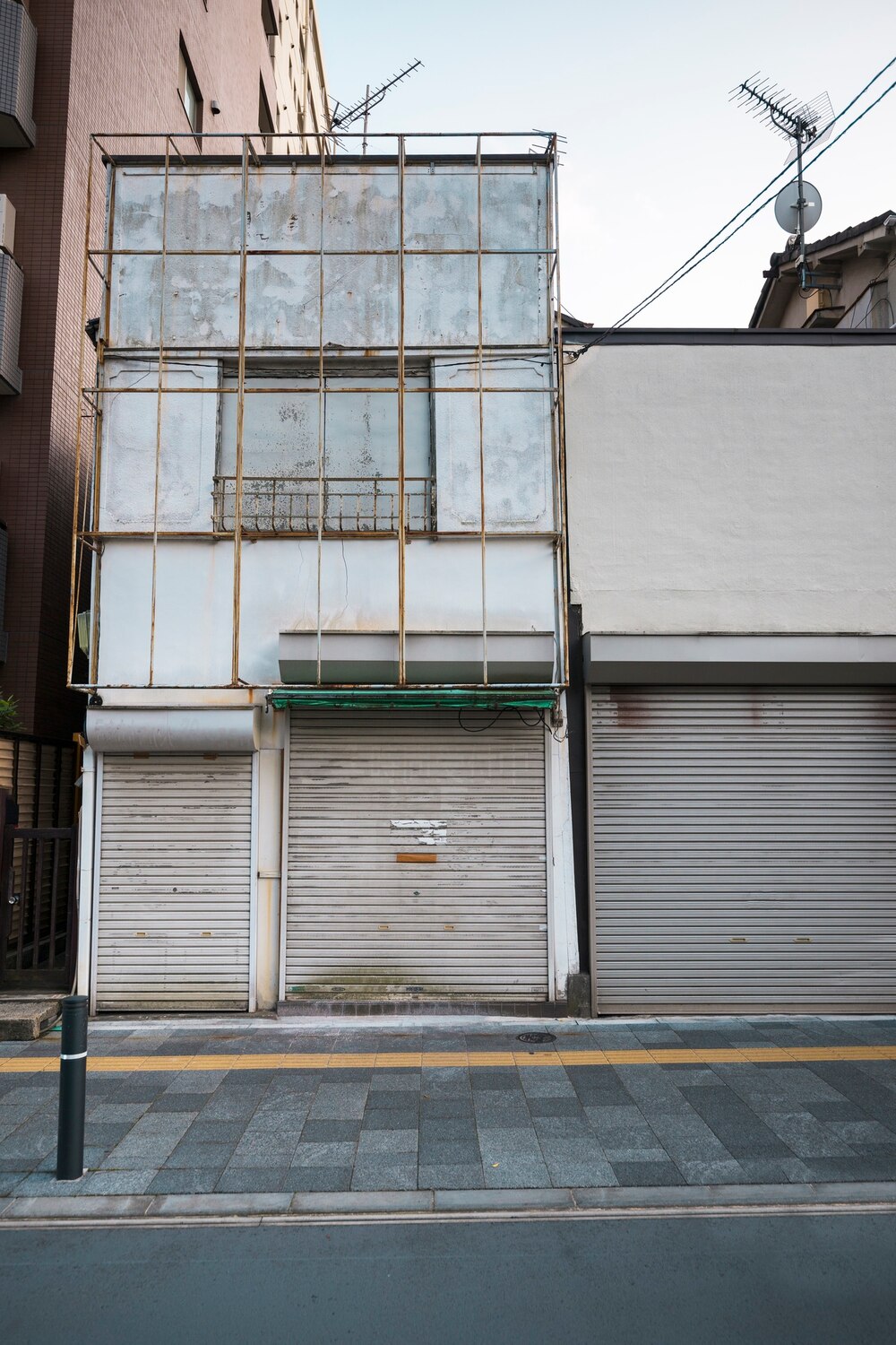 front-view-abandoned-house-with-tall-windows_23-2149454813