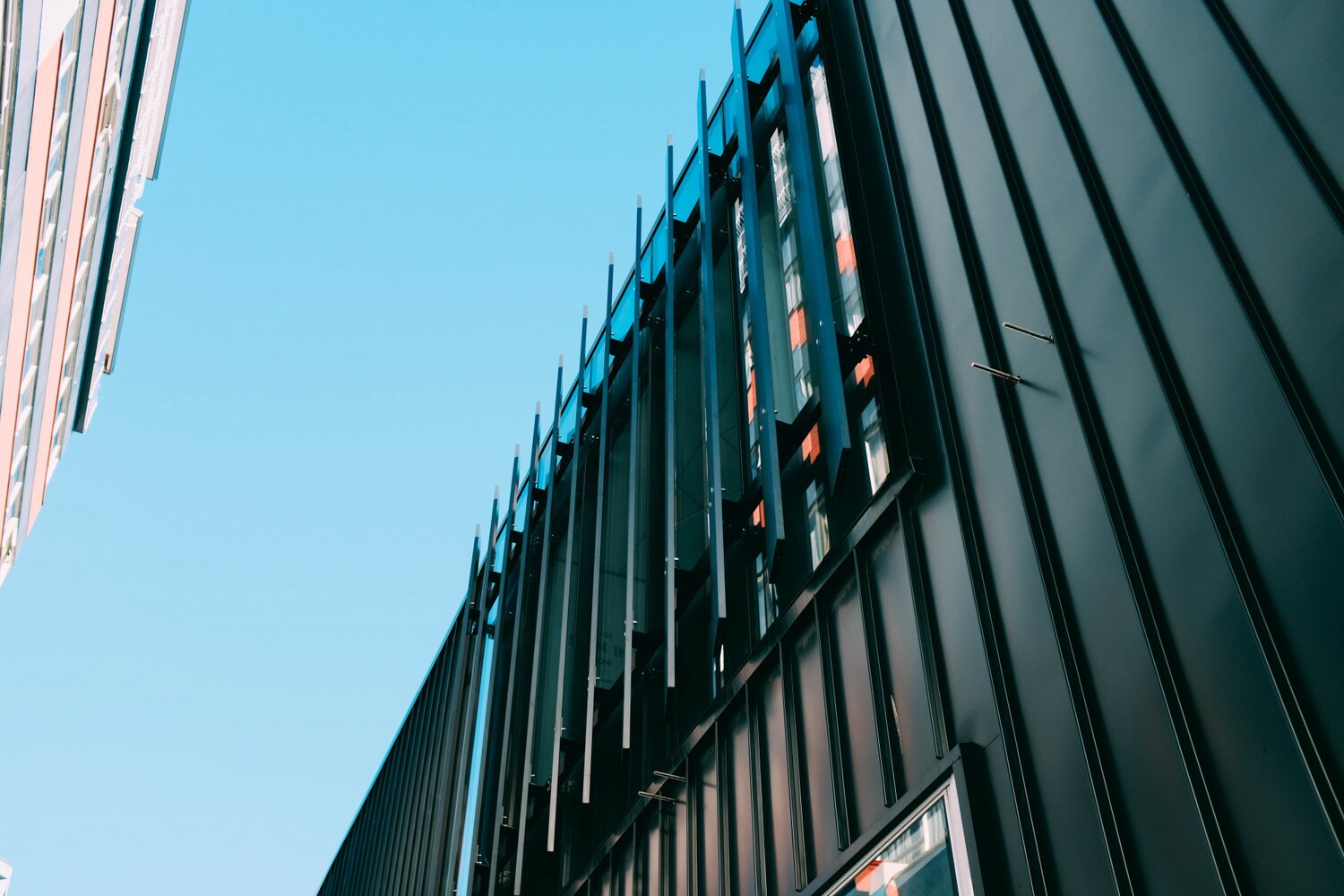 low-angle-shot-modern-building-with-creative-architectural-twists_181624-7121